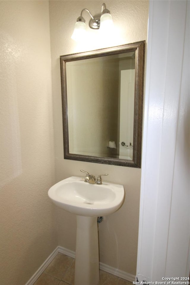 bathroom with tile patterned flooring