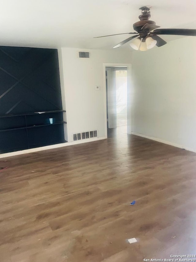 unfurnished living room with hardwood / wood-style floors