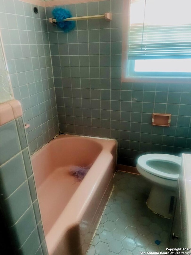 bathroom featuring tile patterned flooring and toilet