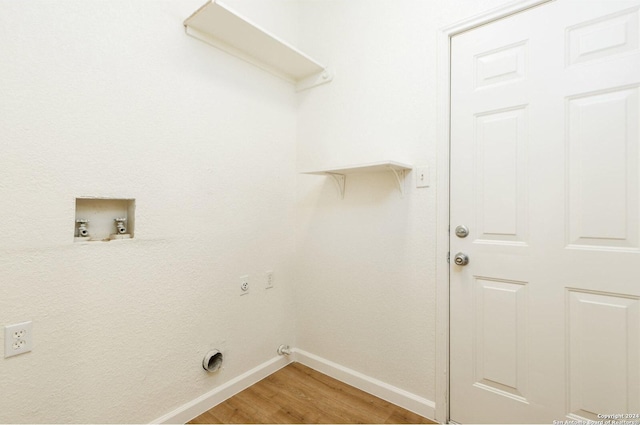 laundry room with hookup for an electric dryer, hookup for a gas dryer, wood-type flooring, and hookup for a washing machine