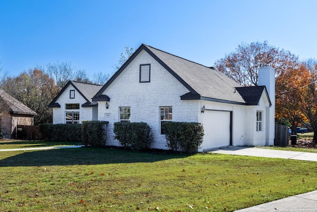 view of property exterior featuring a lawn and a garage