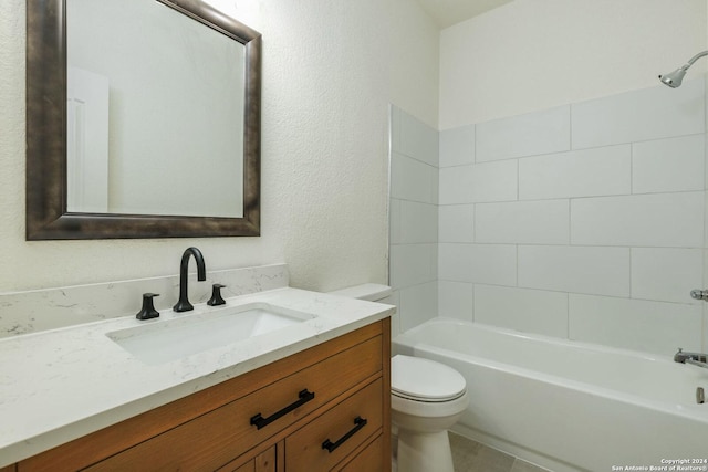 full bathroom featuring vanity, toilet, and tiled shower / bath combo