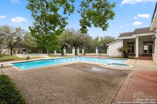 view of swimming pool with an in ground hot tub and a patio