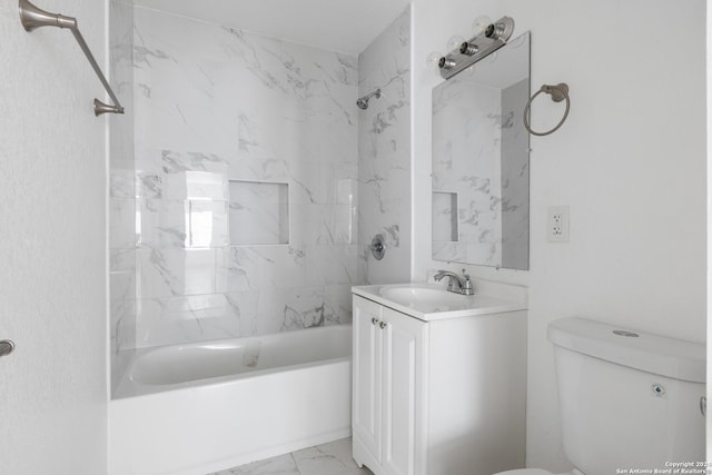 full bathroom featuring vanity, toilet, and tiled shower / bath