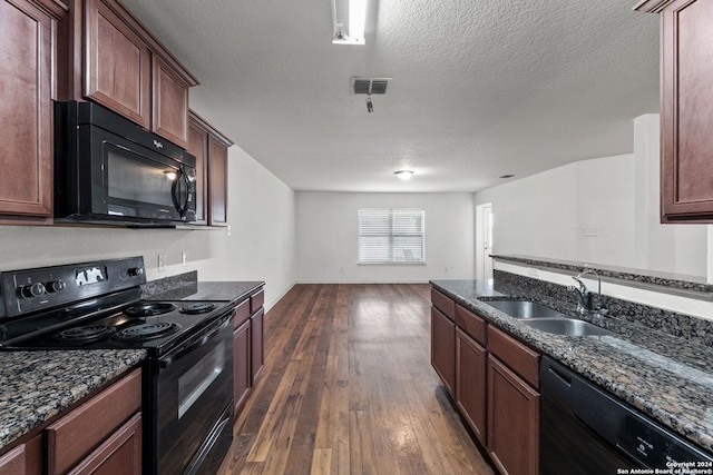 kitchen with dark stone counters, a textured ceiling, dark wood-type flooring, sink, and black appliances