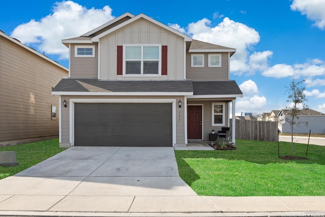 view of front of house with a garage and a front lawn