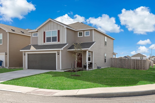 view of front of home with a garage and a front lawn