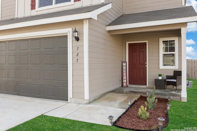 doorway to property with a garage