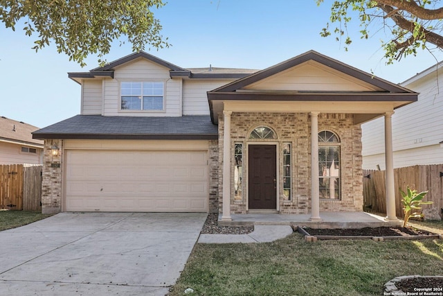 view of front of property featuring a porch and a garage