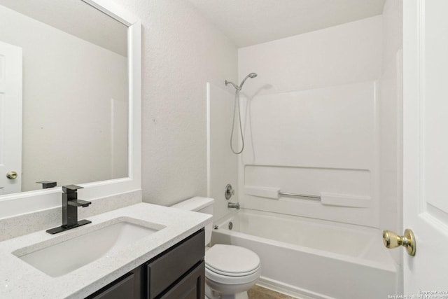 full bathroom featuring shower / tub combination, vanity, and toilet