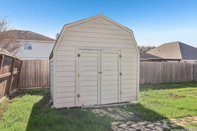 view of outbuilding with a yard