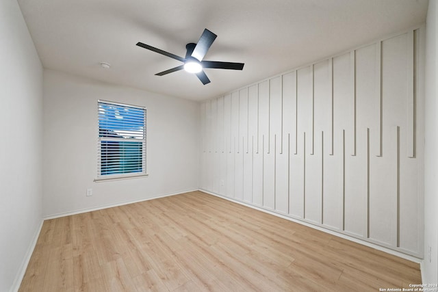 unfurnished room with ceiling fan and light wood-type flooring