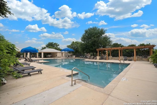 view of pool featuring a patio area and a pergola