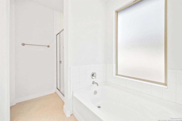 bathroom with plus walk in shower and tile patterned floors