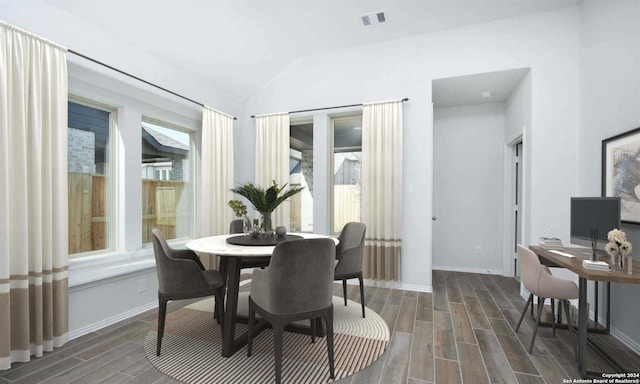 dining area with vaulted ceiling and dark wood-type flooring