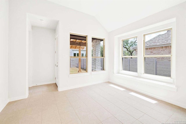 unfurnished sunroom featuring lofted ceiling