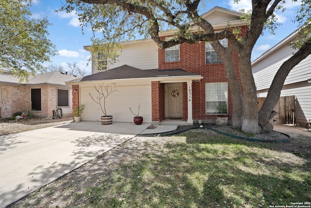 traditional-style house with an attached garage, a front lawn, concrete driveway, and brick siding