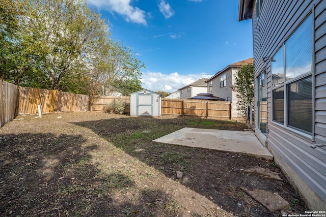 view of yard with a patio and a shed