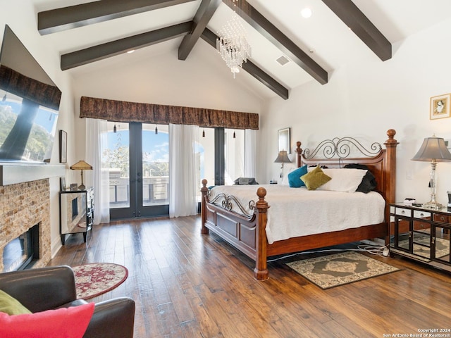 bedroom featuring beamed ceiling, dark hardwood / wood-style flooring, a fireplace, and high vaulted ceiling