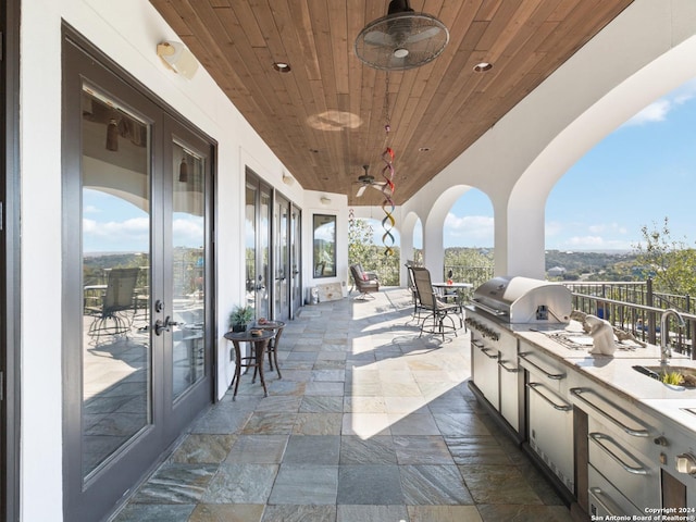 view of patio / terrace with grilling area, french doors, sink, ceiling fan, and area for grilling