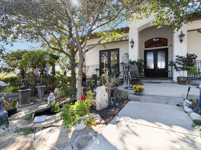 property entrance with french doors and a porch