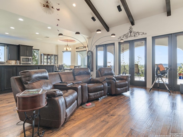 cinema room featuring french doors, beam ceiling, high vaulted ceiling, a notable chandelier, and dark hardwood / wood-style floors