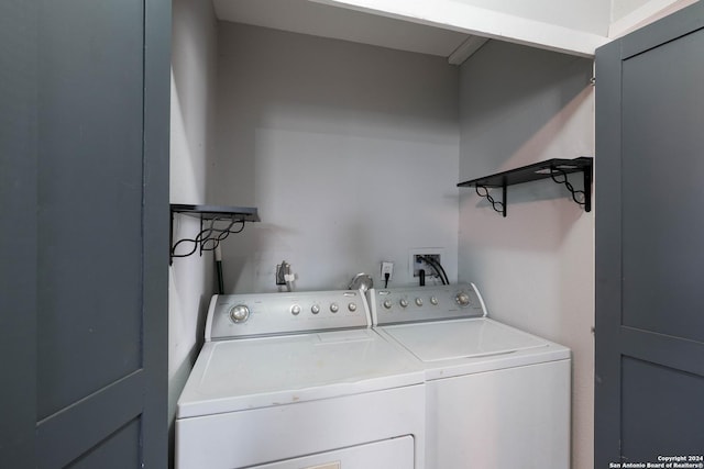 laundry room with washing machine and clothes dryer