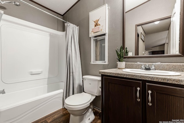 full bathroom featuring shower / bath combination with curtain, vanity, crown molding, wood-type flooring, and toilet