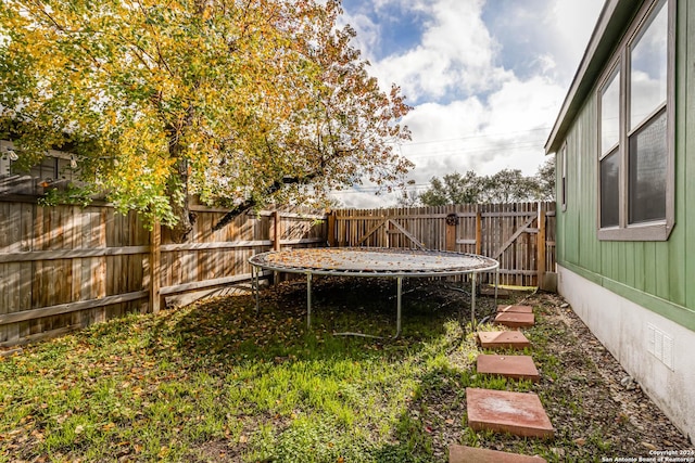 view of yard featuring a trampoline