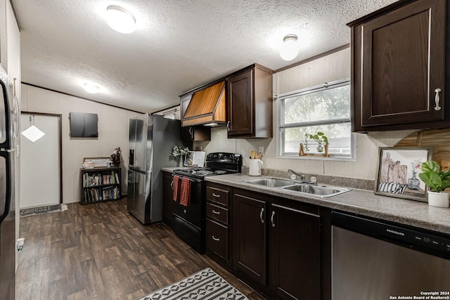 kitchen with lofted ceiling, sink, dark brown cabinets, dark hardwood / wood-style flooring, and stainless steel appliances