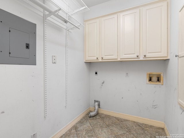 laundry room featuring cabinets, hookup for a washing machine, electric dryer hookup, electric panel, and light tile patterned flooring