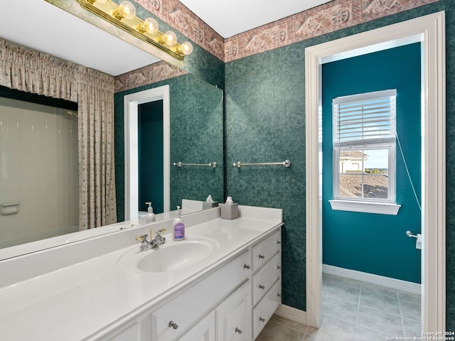 bathroom featuring tile patterned floors and vanity