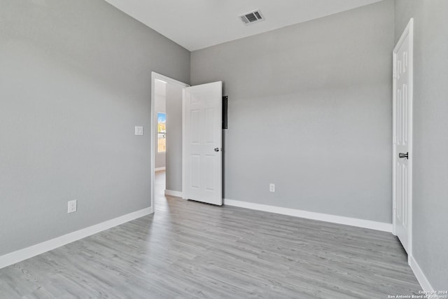 unfurnished room featuring light hardwood / wood-style floors