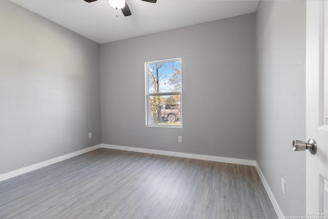 spare room with ceiling fan and hardwood / wood-style floors