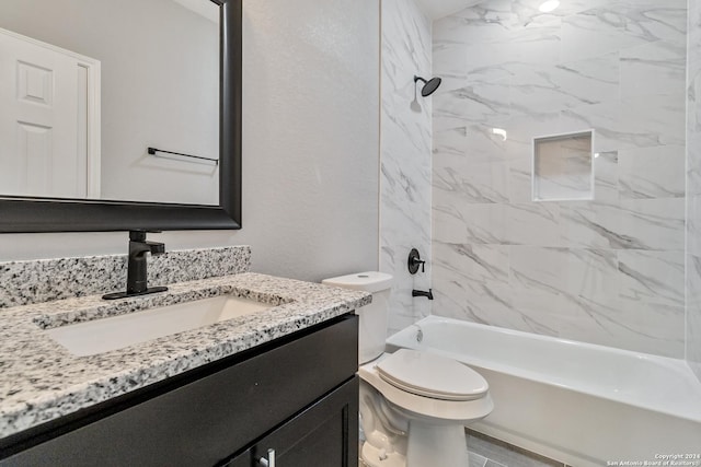 full bathroom featuring vanity, toilet, and tiled shower / bath combo