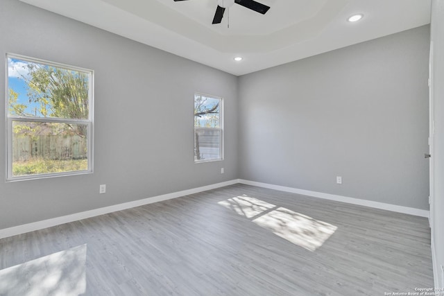 spare room featuring ceiling fan and light hardwood / wood-style floors