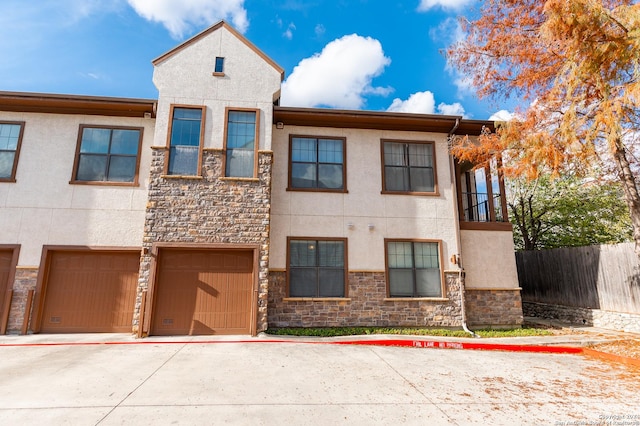 townhome / multi-family property with a garage