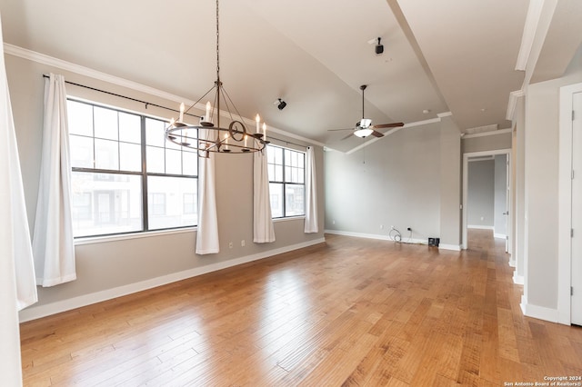 unfurnished dining area featuring crown molding, light hardwood / wood-style flooring, and ceiling fan with notable chandelier