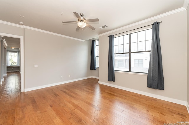 spare room featuring crown molding, light hardwood / wood-style flooring, and ceiling fan