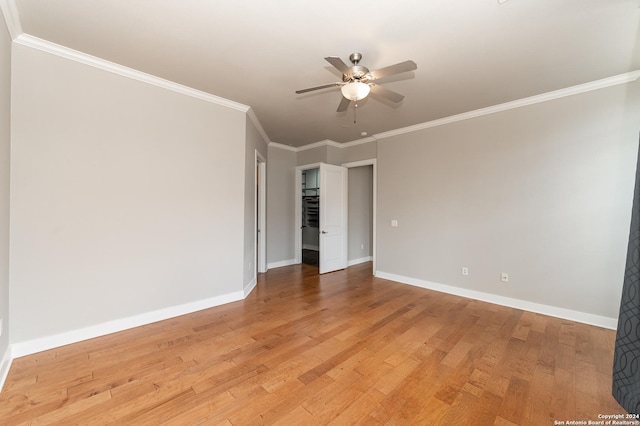 unfurnished room with ceiling fan, light hardwood / wood-style flooring, and ornamental molding