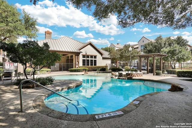 view of pool featuring a pergola and a patio area