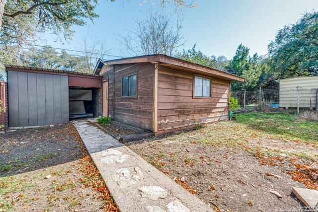 view of side of property with an outdoor structure