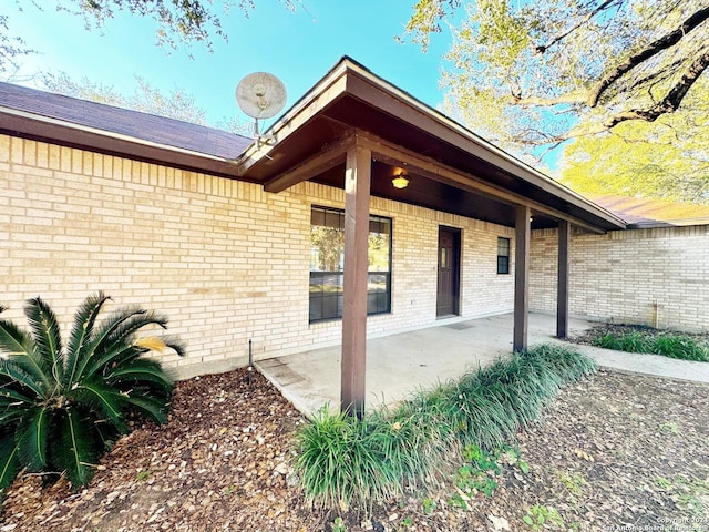 doorway to property featuring a patio area