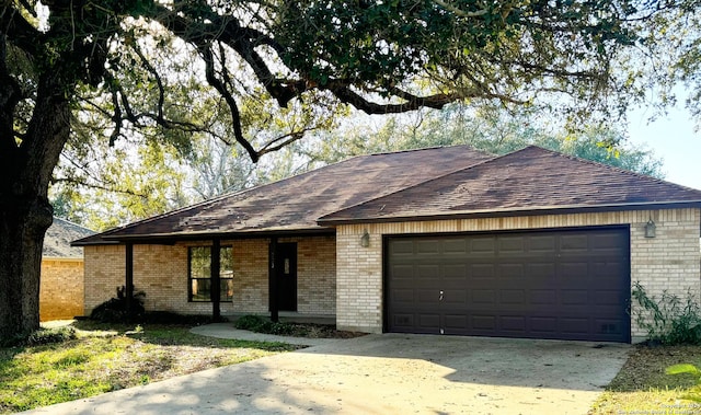 ranch-style house featuring a garage