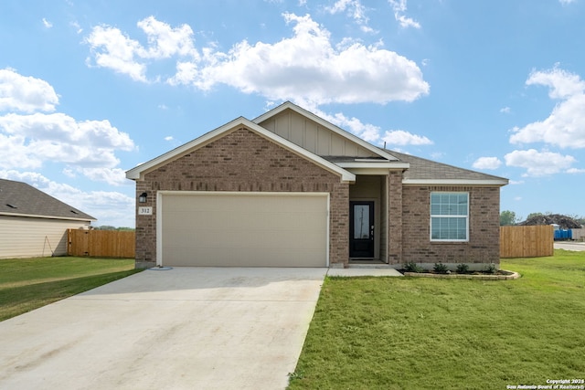 view of front of house with a front yard and a garage