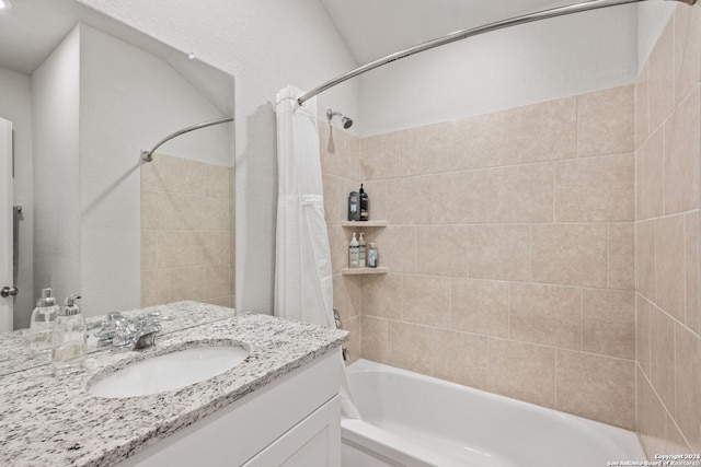 bathroom with shower / bath combo with shower curtain and vanity