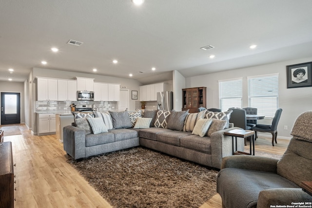 living room with light hardwood / wood-style floors