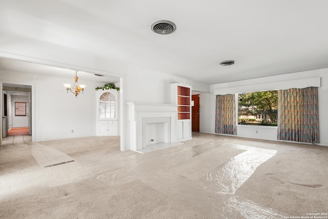 unfurnished living room featuring light colored carpet and an inviting chandelier