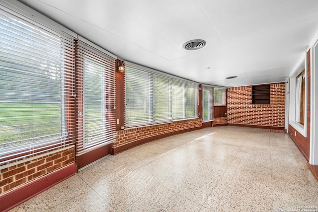 unfurnished sunroom with a healthy amount of sunlight