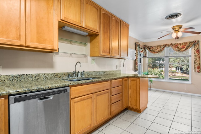 kitchen with stone counters, ceiling fan, sink, stainless steel dishwasher, and ornamental molding